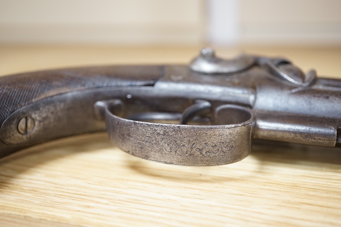 A double barrel over and under 16 bore percussion holster pistol by J. Beattie, barrels 14cm, London proofed, engraved; J. Beattie, Regent Street, London, with foliate engraved boxlock action and finely chequered walnut